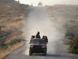 Jund al-Aqsa fighters near Hama, Syria (AFP/Omar Haj Kadour)