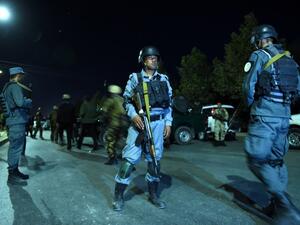 Afghan security personnel stand guard near the site of explosion that targeted the elite American University of Afghanistan in Kabul on August 24, 2016. (AFP/Wakhil Kohsar)