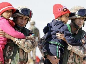 In a new poll, 65 percent of Jordanian respondents believe that the government should encourage Syrian refugees to go back to their country. (AFP/ Khalil Mazraawi)