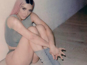 The 37-year-old stunner showcased her enviable figure in a grey tank top and skimpy bikini bottoms as she captioned the photo: 'I need a tan.' (Source: kimkardashian- Instagram)