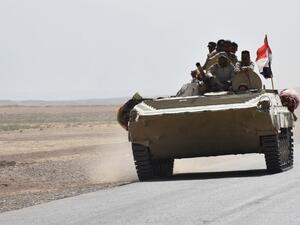 Iraqi army reinforcements drive down a road, linking Hawija to Kirkuk, near the village of Khabbaz on October 7, 2017. (AFP PHOTO / Marwan IBRAHIM)