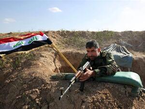 A Kurdish fighter holds a position near Kirkuk, Iraq. (AFP/File)