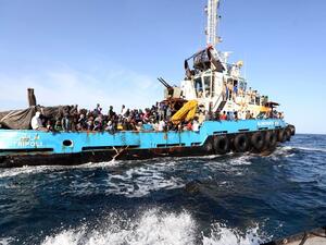 African migrants are rescued by a boat off the coat of Libya after attempting to cross the Mediterranean to Italy. (AFP/File)