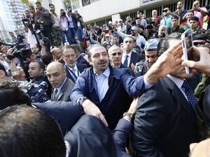 Former Lebanese Prime Minister Hariri takes a selfie with voters outside of a polling station. (AFP/Anwar Amro) Former Lebanese Prime Minister Hariri takes a selfie with voters outside of a polling station. (AFP/Anwar Amro)