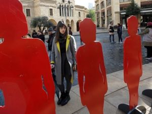 Figures representing women, killed by male relatives in Lebanon, including eight killed in the past 60 days, during a rally organized by activists. (AFP / ANWAR AMRO)
