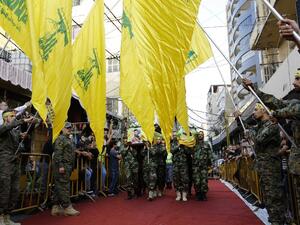 Members and supporters of Hezbollah carry the coffins of Hezbollah's commander Hatem Hamadeh (R) and militant Jalal al-Effeh (L), who were killed in combat alongside Syrian government forces in Syria, on October 18, 2016. (AFP/Anwar Amro)