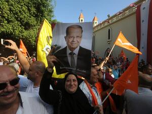 Supporters of Lebanon's Free Patriotic Movement celebrate the election of their leader MP Michel Aoun (portrait) in the town of Jdeideh north of Beirut on October 31, 2016. (AFP/Marwan Tahtah)