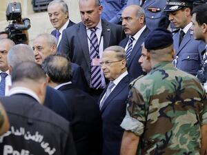 Newly elected Lebanese President Michel Aoun (C) leaves the parliament after a voting session on October 31, 2016 in downtown Beirut. (AFP/Joseph Eid)