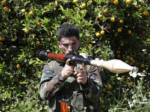 A Hezboallah fighter armed with an RPG stands near Lebanon's border with Israel, April 20 2017. (AFP/Joseph Eid)