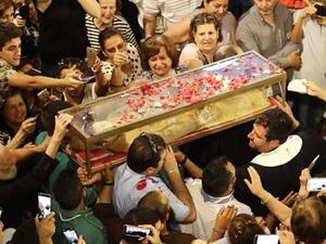 The preserved body of St. Marina was returned from Italy to Lebanon in a glass box. (Daily Star)