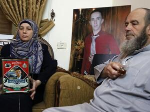 Abdul Fatah al-Sharif and Raja, grandfather and mother of Abdul Fatah who was shot dead by Israeli soldier Elor Azaria while lying wounded on the ground in 2016/ AFP