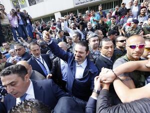 Saad Hariri takes a selfie as he leaves a polling station after voting for the municipal elections. (AFP/ File Photo)