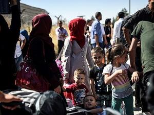 Syrian refugees on their way back to Syrian. (AFP)