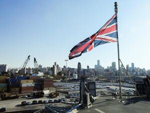 The Union Jack flies from the British Royal Navy's HMS Ocean (L12) amphibious assault ship and helicopter carrier as it lies docked in the port of Beirut. (AFP/Anwar Amro)