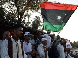 A Libyan protestor waves his national flag during a demonstration in Benghazi in support of General Khalifa al-Haftar, who is aligned with the elected House of Representatives in the eastern city of Tobruk and against the rival UN-backed Government of National Accord (GNA) based in the capital Tripoli and foreign intervention in Libya on August 5, 2016. (AFP/Abdullah Doma) A Libyan protestor waves his national flag during a demonstration in Benghazi in support of General Khalifa al-Haftar, who is aligned with the elected House of Representatives in the eastern city of Tobruk and against the rival UN-backed Government of National Accord (GNA) based in the capital Tripoli and foreign intervention in Libya on August 5, 2016. (AFP/Abdullah Doma)