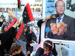 Women place a shoe on a placard bearing a portrait of UN Special Envoy for Libya Martin Kobler during a demonstration against a UN-sponsored agreement on forming a national unity government in the capital, Tripoli, January 8, 2016. (AFP/File) Women place a shoe on a placard bearing a portrait of UN Special Envoy for Libya Martin Kobler during a demonstration against a UN-sponsored agreement on forming a national unity government in the capital, Tripoli, January 8, 2016. (AFP/File)