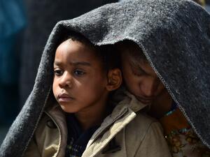 A woman and her daughter protect themselves with a blanket aboard the rescue ship "Aquarius", on May 25, 2016 a day after a rescue operation of migrants and refugees off the Libyan coast. (AFP/Gabriel Buoys) A woman and her daughter protect themselves with a blanket aboard the rescue ship "Aquarius", on May 25, 2016 a day after a rescue operation of migrants and refugees off the Libyan coast. (AFP/Gabriel Buoys)