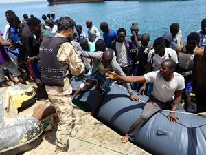 Migrants who were rescued by the Libyan coastguard in the Mediterranean Sea off the Libyan coast, arrive at the naval base in the capital Tripoli on May 6, 2017. (AFP/Mahmud Turkia)