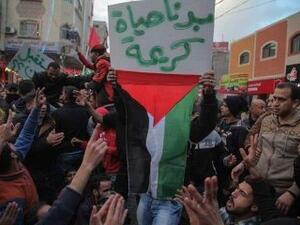 Protesters in Gaza holding sign that reads: "We want decent life". (Twitter/@raid1002)
