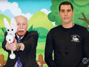 Larry Pratt the lobbyist and executive director emeritus of Gun Owners of America with Sacha Baron Cohen in the  "Who Is America?" series. (Showtime)