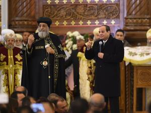 Sisi taking part in the opening ceremony of the church along with the Coptic Pope Tawadros II. (AFP)