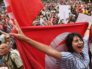 An image was taken from protests in Tunisia for women celebrating the president's proposal for an amended inheritance law that grants women equal rights with men. (AFP)