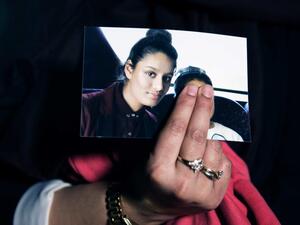 Shamima Begum is seen in a photo held by her sister. (AFP)
