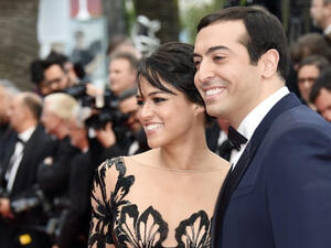 Michelle with her date Saudi Arabian film producer Mohammed al Turki. (AFP)