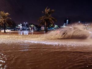 People ride cars on the flooded main road of the Daeya area of Kuwait city late on November 14, 2018. (Yasser Al-Zayyat / AFP)