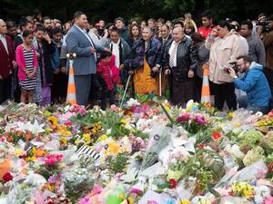 Samoan church members sing next to floral tributes in Christchurch on March 17, 2019 two days after a shooting incident at two mosques in the city. (AFP/ File photo)