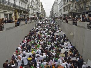 Algerians take part in a demonstration in the capital Algiers against President Abdelaziz Bouteflika on March 19, 2019. (RYAD KRAMDI / AFP)