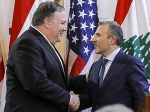 Lebanese Foreign Minister Gibran Bassil (R) shakes hands with visiting US Secretary of State Mike Pompeo following a public statement in the Lebanese capital Beirut on March 22, 2019. (JIM YOUNG / POOL / AFP)