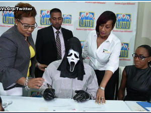 Lottery winner claims prize in Scream mask to hide identity. (YouTube Screenshot)