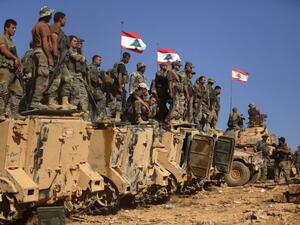 Lebanese soldiers stand on armoured vehicles on a hill they took from the Islamic State (IS) group in Jurud Ras Baalbek on the Syrian-Lebanese border. (AFP/File)