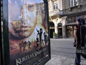 Woman passes by 'Turkish James Bond' film poster. (AFP/ File)