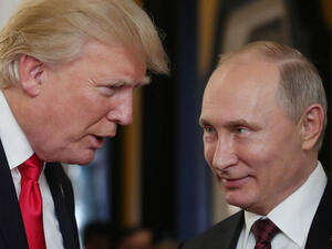 U.S. President Donald Trump chats with Russia's President Vladimir Putin as they attend the APEC Economic Leaders' Meeting. (AFP/File)