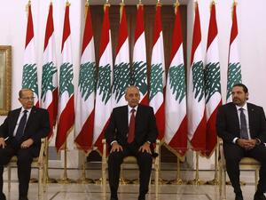 Lebanese prime minister Saad Hariri (R) meets President Michel Aoun (L) and Parliament speaker Nabih Berri(C) at the presidential palace in Baadba. (AFP File Photo)