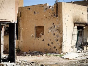 A building damaged by serious gunfire in Misrata, Libya. (AFP/File)