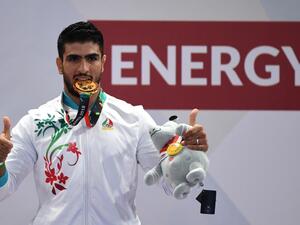 Iran's Mohsen Mohammadseifi poses with his gold medal at the men's sanda 70kg wushu medal ceremony of the 2018 Asian Games in Jakarta on August 23, 2018.
Juni Kriswanto / AFP