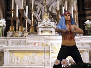 Femen protestors also targeted France and Spain along with the Vatican during Christmas celebrations (Thomas Samson/AFP)