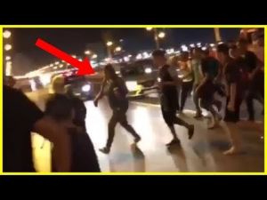 The video, lasting just 10 seconds, shows a clearly panicking woman in jeans and a t-shirt being chased by a large group of young men | Youtube.