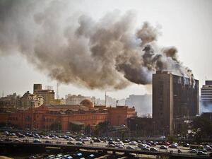 Former president Mubarak's headquarters are torched during the 2011 Revolution (Flikr/Darkroom Productions)
