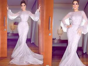 تميز فستان المصمم يوسف الجسمي الذي ارتدته بلقيس بلونه البنفسجي الناعم