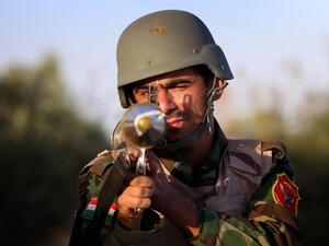 A Kurdish Peshmerga fighter poses with his weapon on the front line in Makhmur, Iraq. The Peshmerga are fighting to protect Kurdistan. (AFP/File)