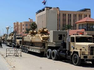 File picture shows an Egyptian miltary convoy in the North Sinai provincial capital El-Arish. (AFP/File) File picture shows an Egyptian miltary convoy in the North Sinai provincial capital El-Arish. (AFP/File)