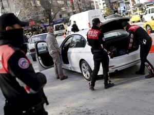 Police officers search a car during a security control check in central Ankara. (AFP/File)