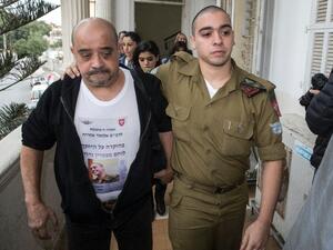 Azaria's father, Charlie, reportedly sat down with Col. Guy Hazut, the commander of the Kfir Brigade, in which his son serves. (AFP/File)