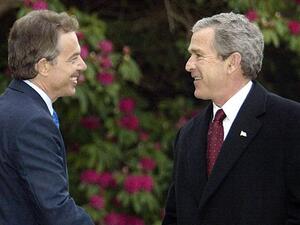 Photo taken on April 8, 2003 shows former US President George W. Bush (R) greets former British Prime Minister Tony Blair (L) at Hillsborough Castle in Northern Ireland. (AFP/File)