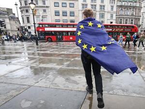 A demonstrator wrapped in a European flag leaves an anti-Brexit protest in Trafalgar Square, London. (AFP/File)
