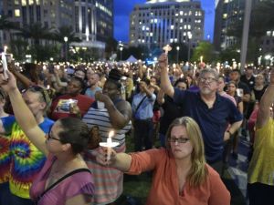 Huge crowds attend a candlelit vigil in Orlando for the victims of the Pulse nightclub shooting. (AFP/File)
